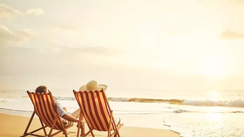 xretirement wishes beach chairs sunset couple 800x601.jpg.pagespeed.ic.0mtsaqbneq